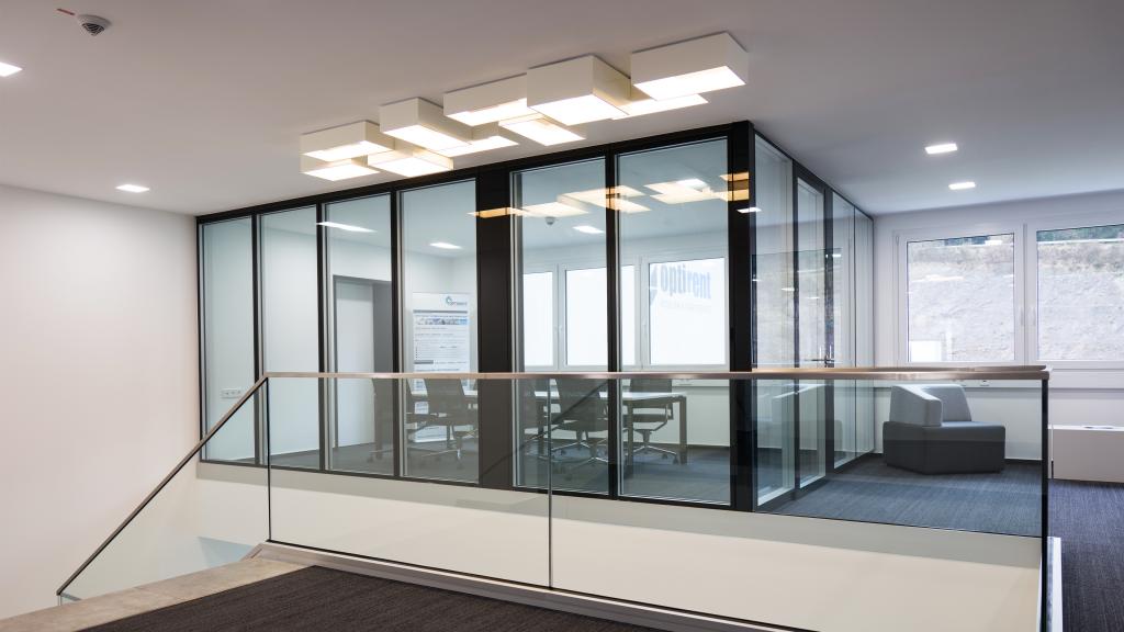 Meeting room with glass walls in the modular administration building Optirent