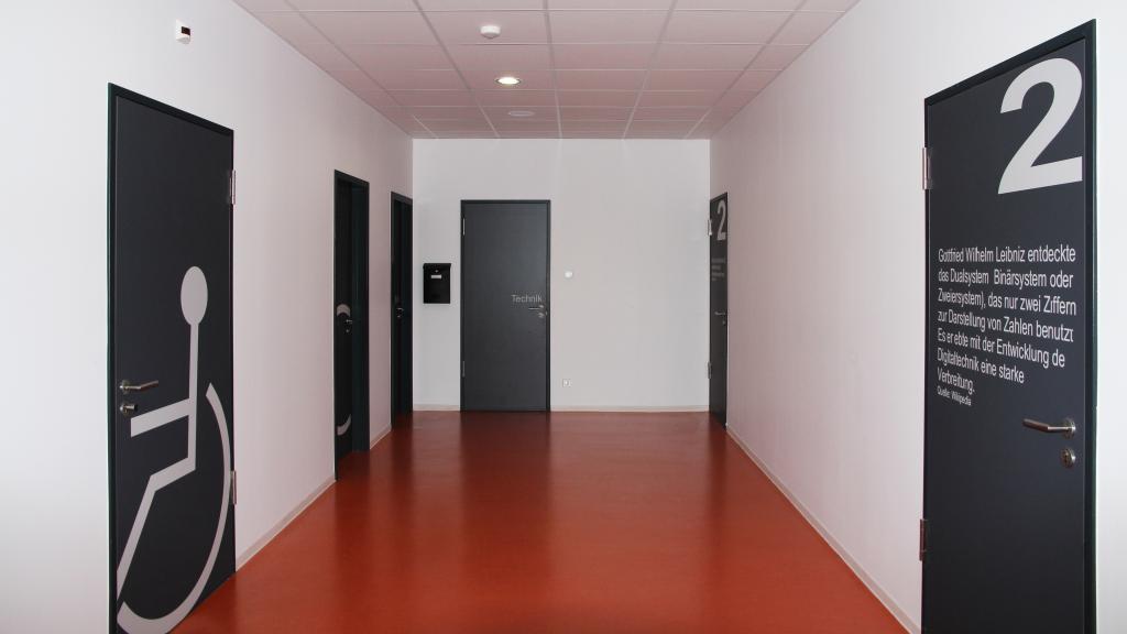 Corridor to the sanitary areas in the canteen of the all-day care school Külsheim 