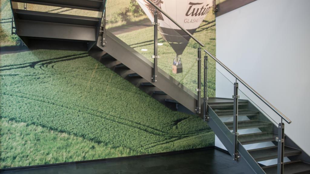 Staircase with glass railing in the technical office building by SÄBU Morsbach