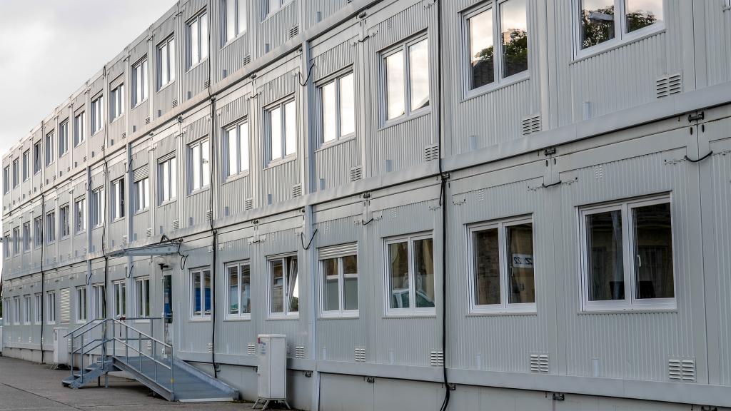 View of a façade of an administration building made of containers of the OPTILine