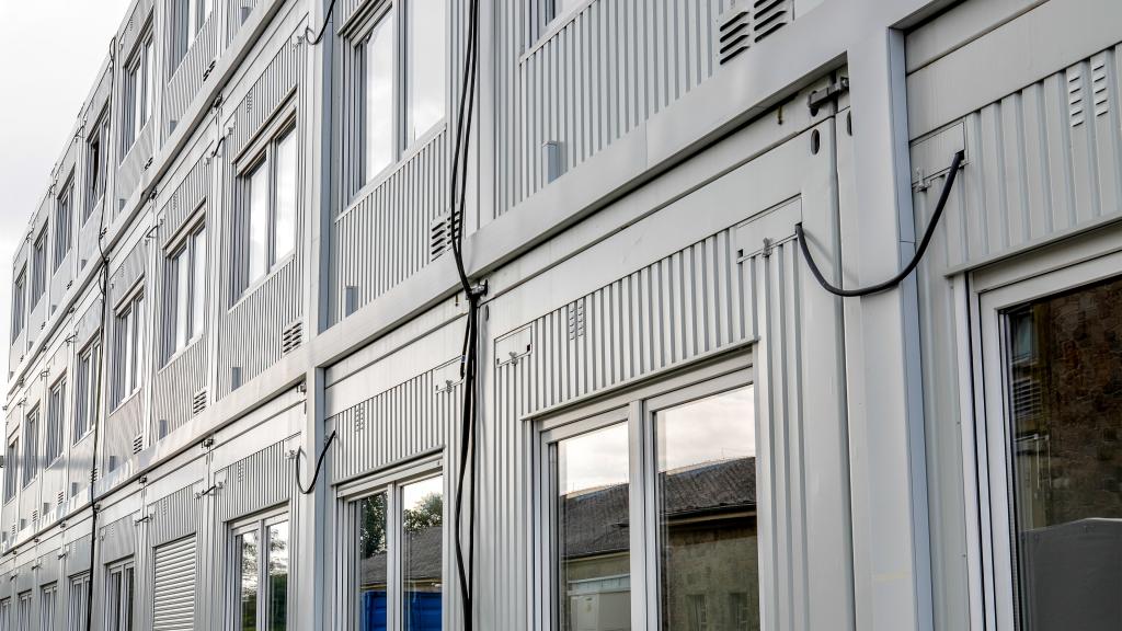 detail of the façade of an OPTILine office building in container design